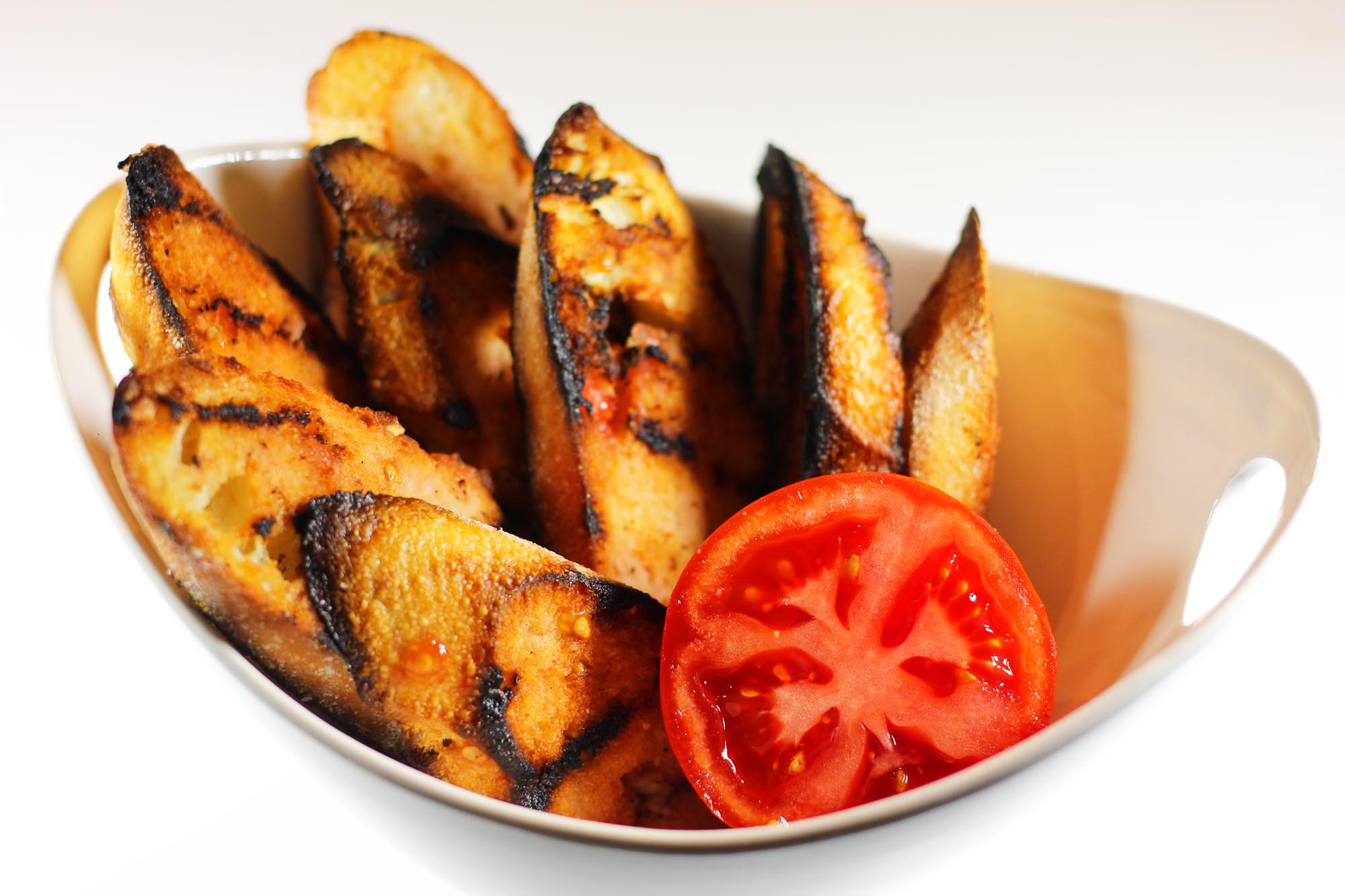 Grilled Baguette with Fresh Tomato Rub - Inspired Cuisine