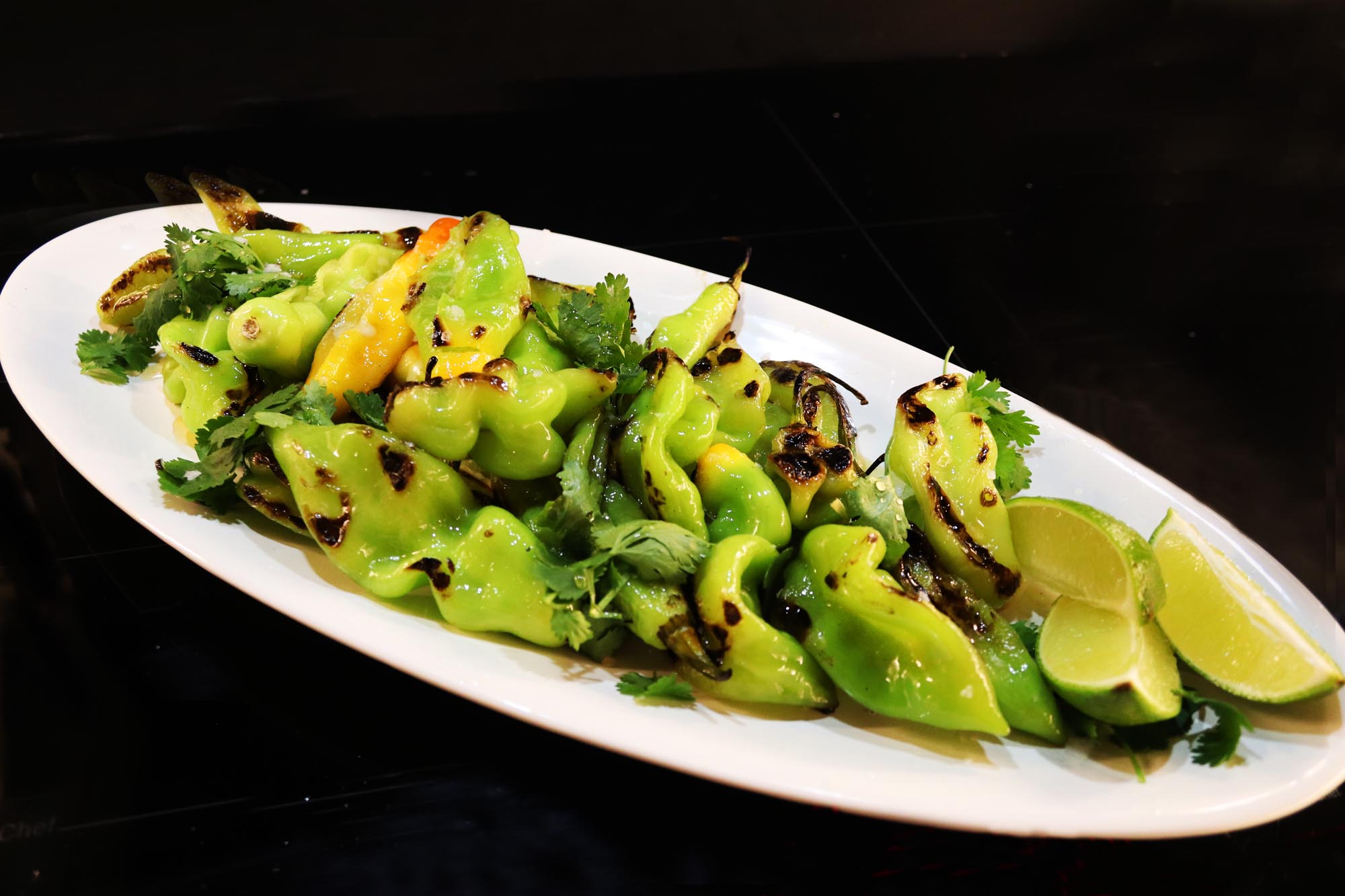 Hot Honey and Sea Salt Blistered Shishito Peppers - Inspired Cuisine